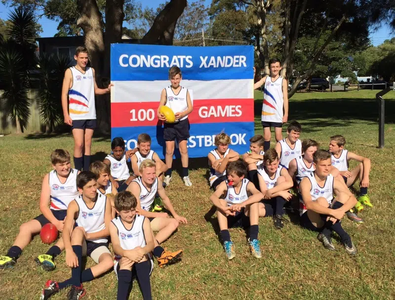 Xander Vink celebrates his 100th Sydney AFL game